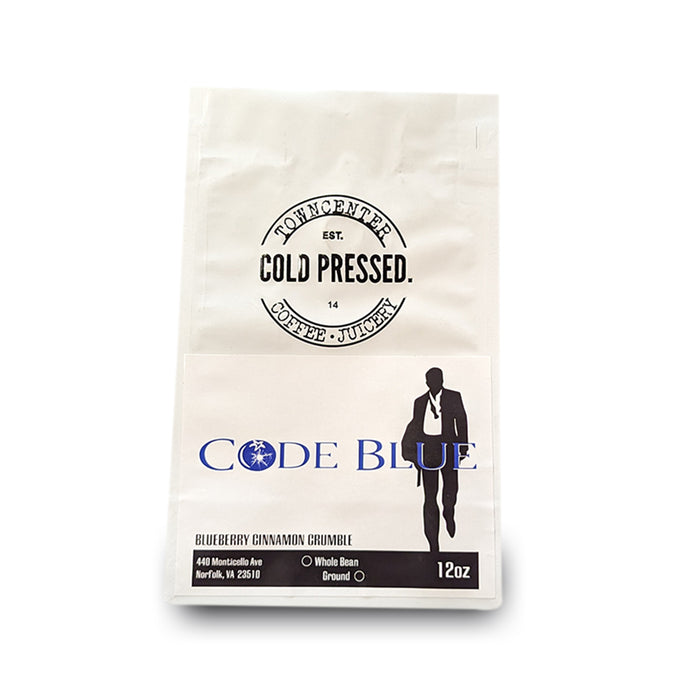 Shown here is a 12-ounce coffee bag of our Code Blue Blueberry Cinnamon Flavored Coffee sold by Town Center Cold Pressed and proudly roasted in Norfolk, VA.