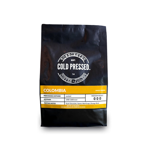 Shown here is a 12-ounce coffee bag of our Columbia Single Origin Coffee sold by Town Center Cold Pressed and proudly roasted in Norfolk, VA.