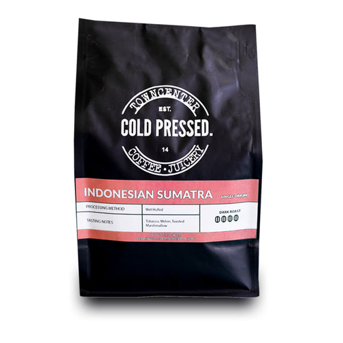 Shown here is a 12-ounce coffee bag of our Indonesian Sumatra Single Origin Dark Roast Coffee sold by Town Center Cold Pressed and proudly roasted in Norfolk, VA.