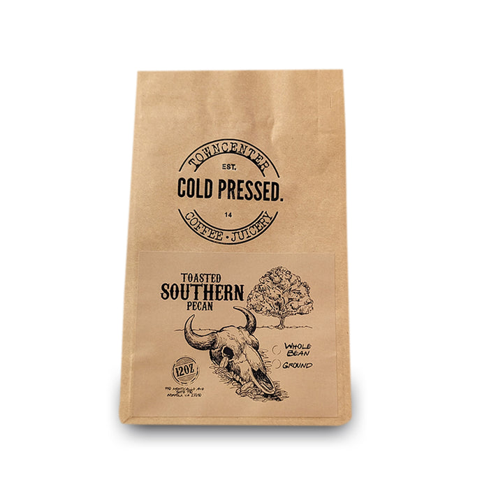 Shown here is a 12-ounce coffee bag of our Toasted Southern Pecan Flavored Coffee sold by Town Center Cold Pressed and proudly roasted in Norfolk, VA.